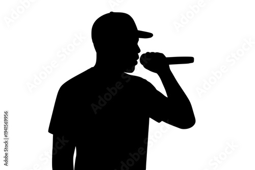 Silhouette of man in cap singing into microphone