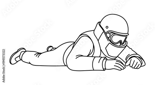Skydiver in prone position, wearing helmet and goggles, ready for freefall jump