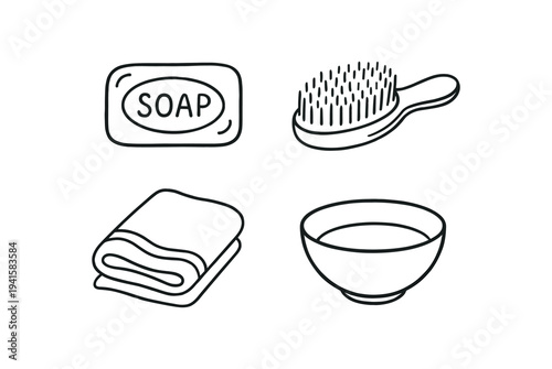 Simple black line icons of a soap bar labeled "soap," a bristle brush, a folded towel, and a small wash bowl — bathroom and hygiene items shown as a clean flat icon set.