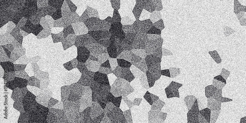 Abstract grayscale mosaic pattern with grainy texture and irregular polygonal shapes in varying shades of dark gray and white creating a textured background