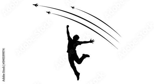 Silhouette of a man jumping in joy with fighter jets flying overhead