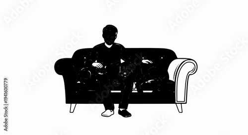 A person and two dogs relax on a plush, dark sofa