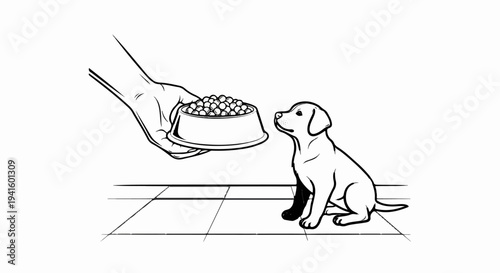 A hand holds a bowl of food for a seated puppy on a tiled floor