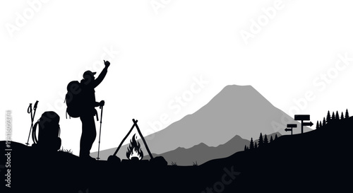 Hiker silhouette celebrating near campfire in mountain landscape