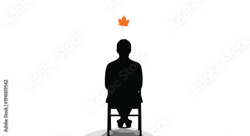 Man sitting with falling leaf autumn concept