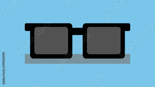 Black sunglasses on a gray surface against a blue background.