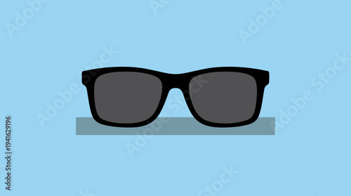 Black sunglasses on a blue background with shadow.