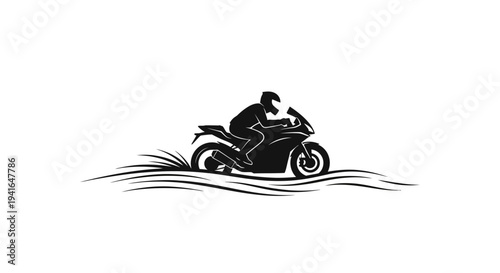 Silhouette of a motorcyclist riding a sportbike through water, creating splashes.
