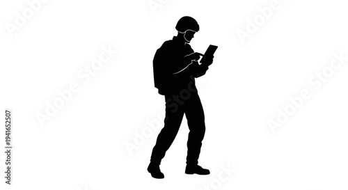 Silhouette of a soldier using a tablet computer in a white background