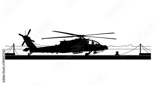 Silhouette of an attack helicopter on a ship deck, ready for takeoff, military aviation