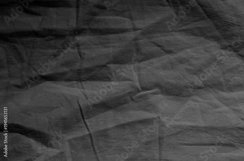 Gray crumpled fabric. Background texture.