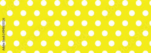 Hand drawn white color cute seamless polka dots patterns on a light yellow background. Vintage polka dots used in graphic design, pop art, home decoration and textile product.