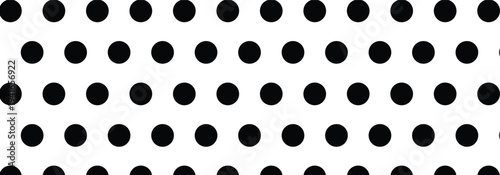 Doodle black polka dots pattern on a white background. Polka dot seamless pattern background used in fashion, packaging and graphics design.