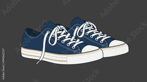 Pair of blue sneakers with white laces on dark background.