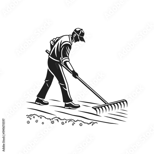 Person using a garden rake to level soil in backyard gardening activity