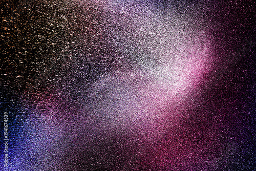 Black dark indigo blue gold orange glitter shiny abstract background for design. Twinkling glow stars effect. Fantastic, fantasy. Like outer space, night sky, universe. Grain, rough surface.