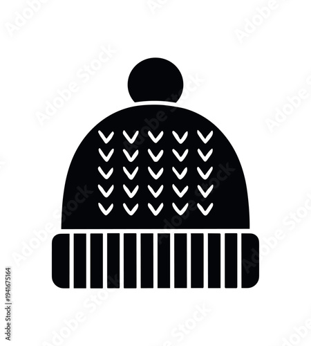 Solid black icon of a knit winter hat featuring a pompom on top, patterned stitches on the body, and a ribbed folded cuff — a simple cold-weather accessory symbol.