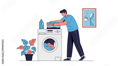 Young man efficiently loads clothes into a modern washing machine, performing daily household chores with laundry detergent and a plant nearby.