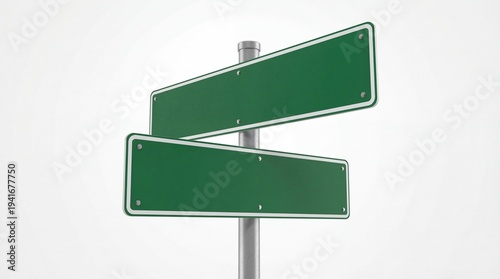 Green directional signpost with two blank boards on a metal pole