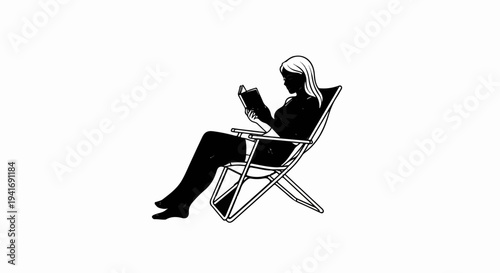 Person relaxing in a lounge chair reading a book