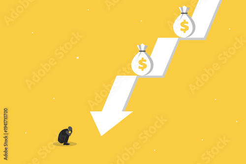 Businessman crouching in despair at a falling downward arrow with dollar symbols, representing financial loss, economic crisis, and bankruptcy