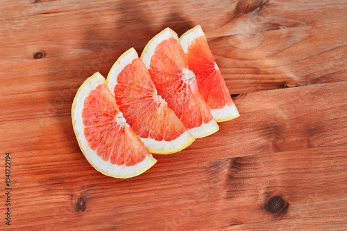 Sliced grapefruits on table