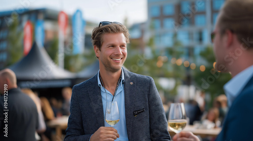 Innovative financial ecosystem depicted outdoors at a networking event under a sunny sky, featuring professionals mingling with drinks in hand. A cheerful atmosphere with colorful banners showcases