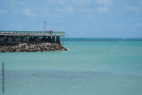 Construction work on a new pier on Iracema beach, with numerous vendor stalls and other amenities for beachgoers. Fortaleza - Ceará, Brazil.