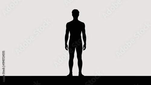 A black silhouette of a man standing alone in a plain background