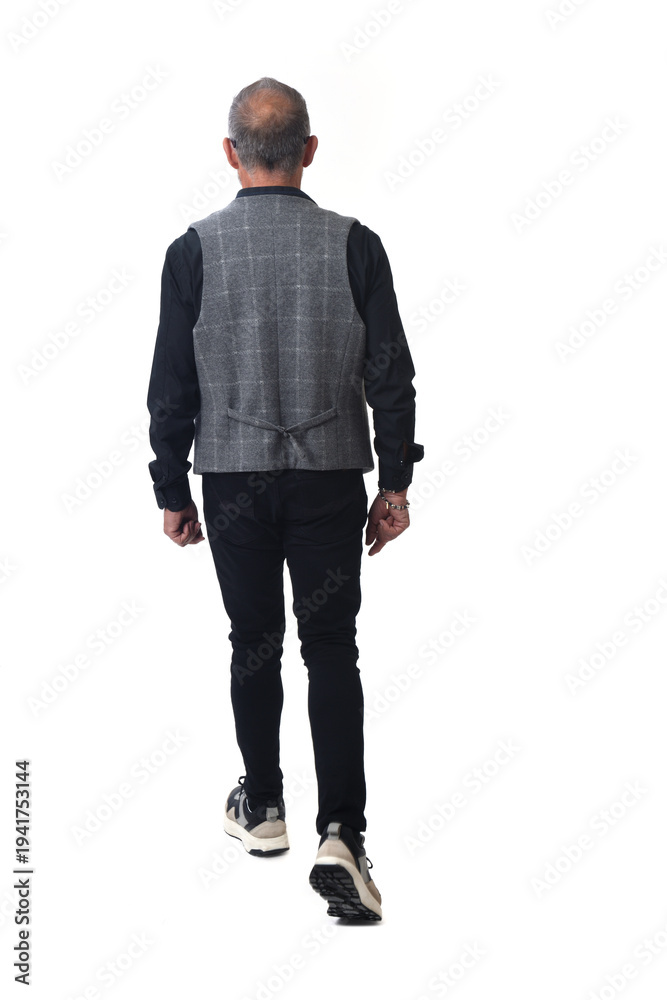 Fototapeta premium back view of a modern retired man walking on white background