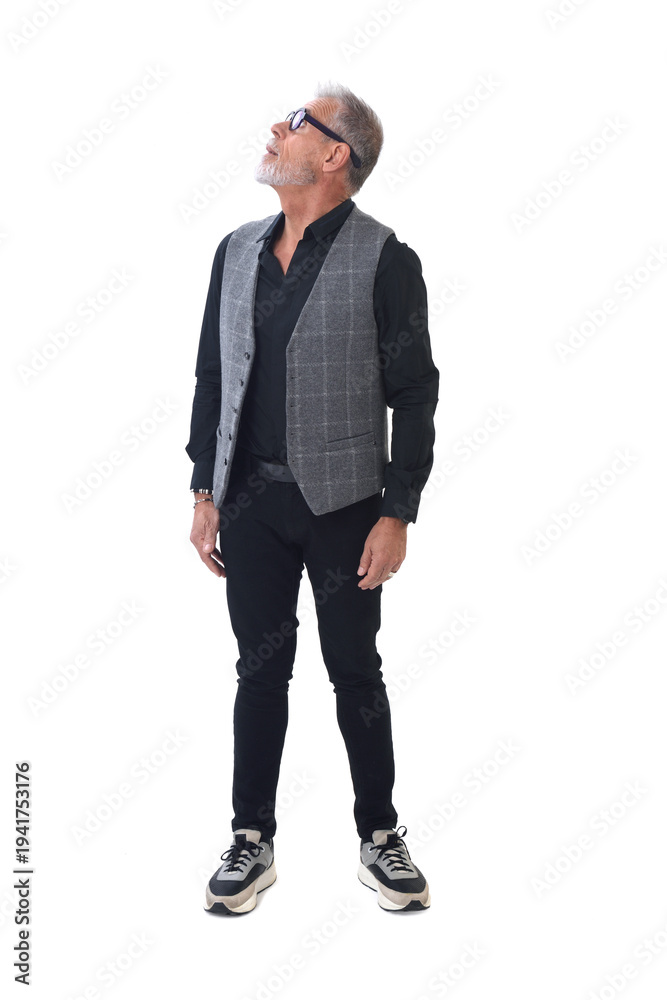 Fototapeta premium Front view of a modern retired man standing and look up on white background