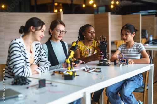 Fotografía Diverse group of students and teachers engaged in a robotics workshop, learning