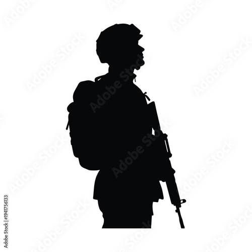 Silhouette of soldier with rifle and backpack standing