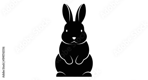 Black silhouette of a cute bunny rabbit standing upright.