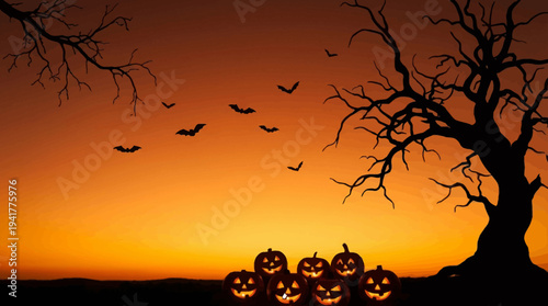 Spooky Halloween Background with Glowing Jack-O-Lanterns Silhouetted Gnarled Trees and Bats at Sunset