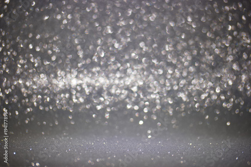 Foto Light reflections create a sparkling background with shining particles in a brig