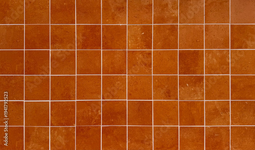 Fotografie Rustic terracotta square tile wall texture with white grout lines