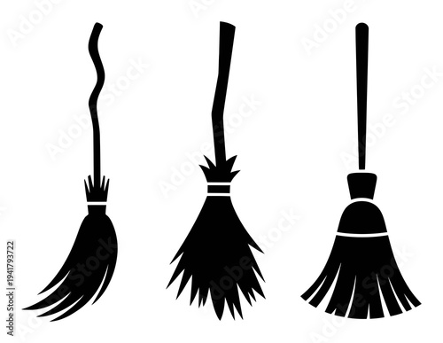 Three Silhouetted Brooms: A Witch's Essential Tools for Halloween