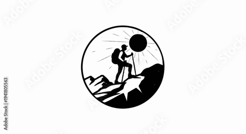 Silhouette of hiker on mountain peak under bright sun