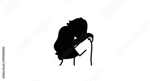 Silhouette of a person resting head on a simple block, appearing thoughtful or sad