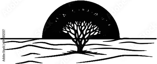 Silhouette of a tree against a rising or setting sun over barren land