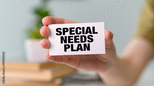 Hand holding a card with Special Needs Plan text, focusing on financial and educational support for people with disabilities.