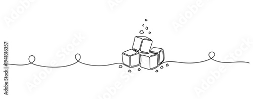 Sugar cubes piled with scattered granules on white surface