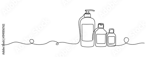 Assorted toiletry bottles arranged on white background