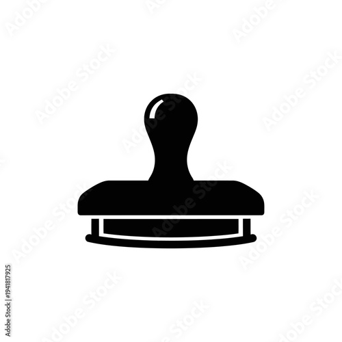 Black rubber stamp for document approval.