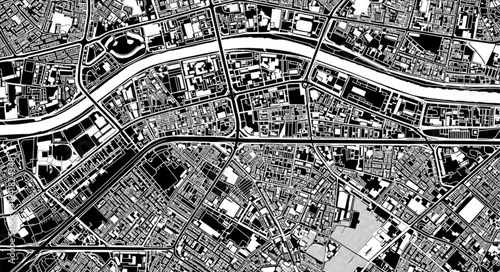 Aerial View of Urban Landscape with River and Buildings.