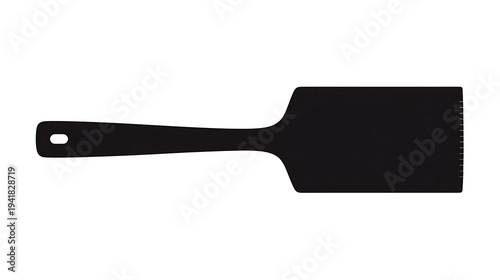 A black spatula laying. The spatula is clean and ready for cooking