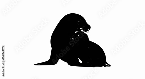 Two black seals, one large and one small, embrace tenderly