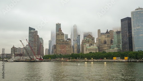Golden hour ferry perspective captures Lower Manhattan skyscrape