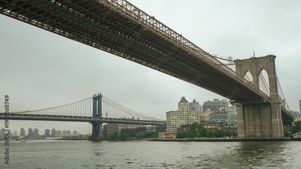 Fototapeta premium Golden sunset over Manhattan and Brooklyn Bridge from New York f